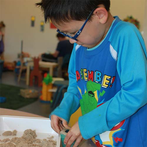 young boy playing at child care