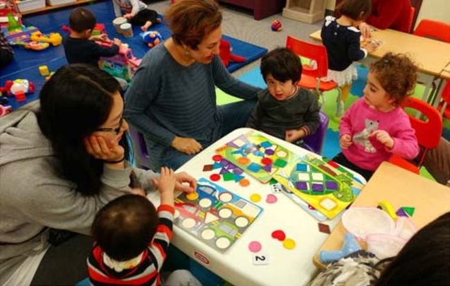 Children playing games with adults